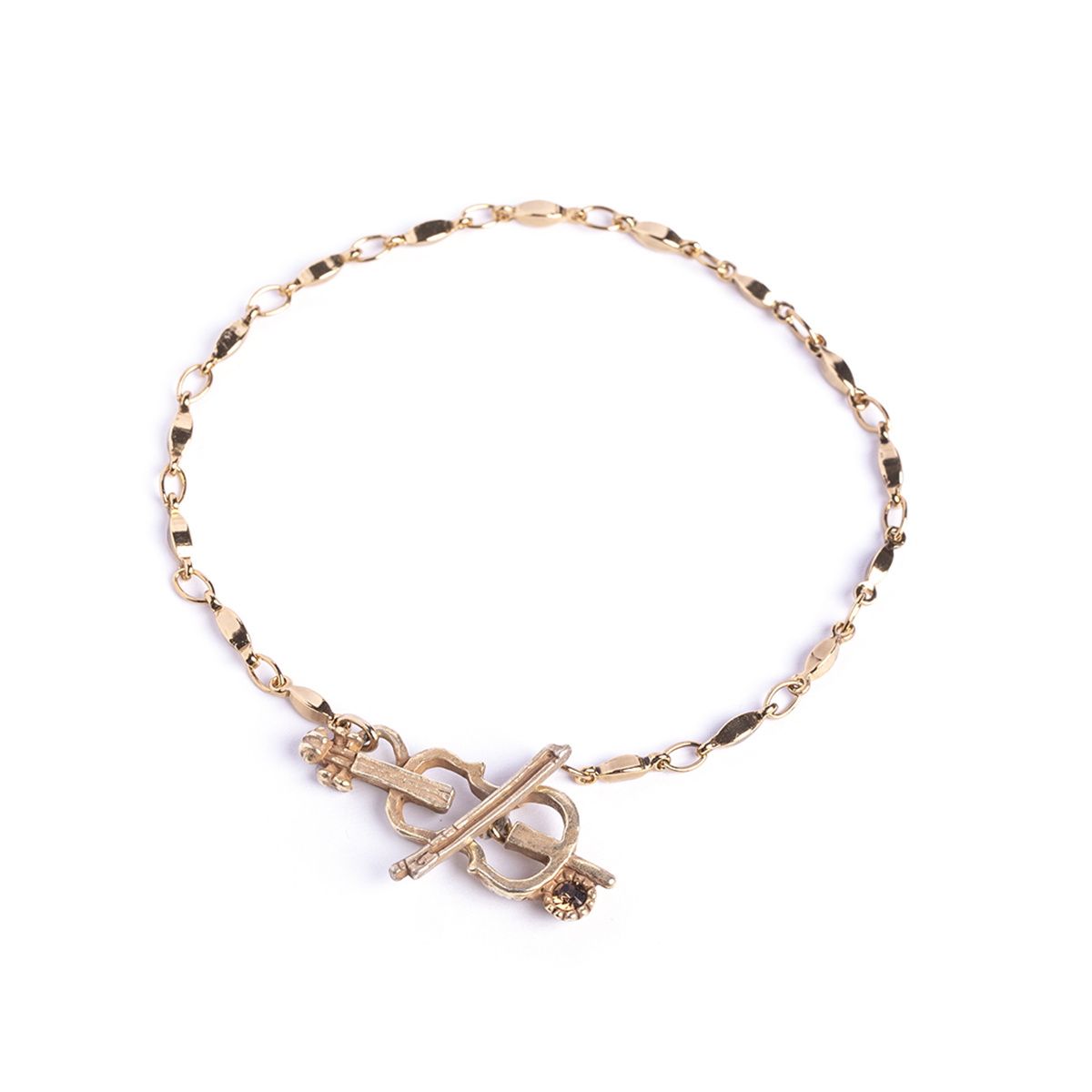 チェロと弓モチーフのブレスレット ブラウンのカットガラスが手元を彩る上品な音楽アクセサリー